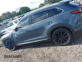 2021 Mazda CX-9 Grand Touring with VIN JM3TCADY7M0528223, listed as a IAAI auction lot 42395861 with 57,767 mi miles and . Bid and sale history available at DreamBid. Image 14.