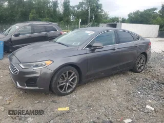 2019 Ford Fusion SEL z VIN 3FA6P0CD7KR260845, wystawiony jako Copart lot #65777665 z przebiegiem 120 434 mil mil oraz Czysty tytuł • Clean title. Historia ofert i sprzedaży dostępna na DreamBid. Obrazek 1.