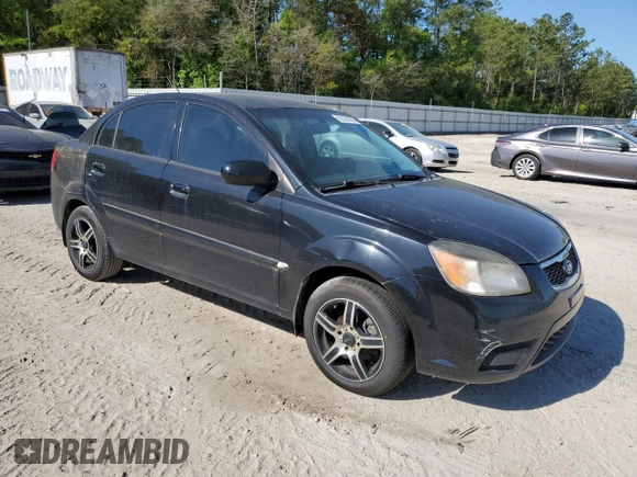 2011 Kia Rio LX with VIN KNADH4A31B6749736, listed as a Copart auction lot 53128685 with 103,392 mi miles and Clean Title. Bid and sale history available at carsss.com. Image 4.