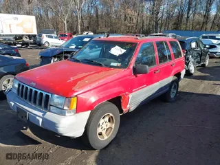 1997 Jeep Grand Cherokee Laredo with VIN 1J4GZ58S0VC550242, listed as a IAAI auction lot 41032114 with 185,307 mi miles. Bid and sale history available at carsss.com. Image 2.