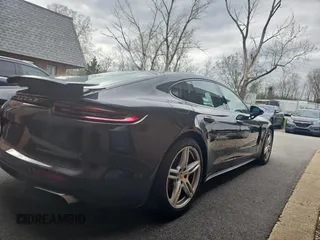 2018 Porsche Panamera with VIN WP0AA2A73JL104278, listed as a Copart auction lot 54095695 with 100,942 mi miles and Clean Title. Bid and sale history available at DreamBid. Image 4.