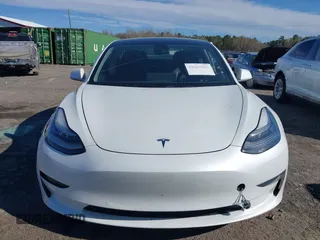 2020 Tesla Model 3 Standard Range Plus with VIN 5YJ3E1EA7LF797150, listed as a IAAI auction lot 41869088 with 75,708 mi miles and . Bid and sale history available at carsss.com. Image 12.