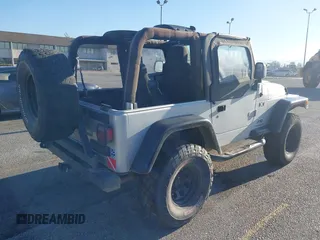 2005 Jeep Wrangler X with VIN 1J4FA39S55P348432, listed as a IAAI auction lot 41868451 with 166,876 mi miles. Bid and sale history available at carsss.com. Image 4.