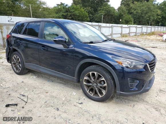2016 Mazda CX-5 Grand Touring with VIN JM3KE4DY6G0657291, listed as a Copart auction lot 69763144 with 122,312 mi miles and Salvage Title. Bid and sale history available at carsss.com. Image 4.