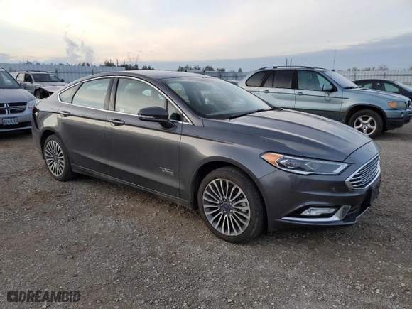 2017 Ford Fusion Energi SE with VIN 3FA6P0PU3HR354658, listed as a Copart auction lot 71824902 with 67,618 mi miles. Bid and sale history available at carsss.com. Image 4.