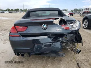 2016 BMW M6 z VIN WBS6G9C58GD931908, wystawiony jako Copart lot #72067214 z przebiegiem 84 170 mil mil oraz Szkody całkowita. Historia ofert i sprzedaży dostępna na DreamBid. Obrazek 6.