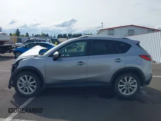 2014 Mazda CX-5 Grand Touring with VIN JM3KE4DY9E0375014, listed as a IAAI auction lot 42000382 with 110,584 mi miles and . Bid and sale history available at DreamBid. Image 15.