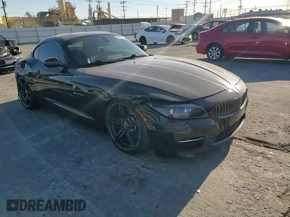 2011 BMW Z4 sDrive35is with VIN WBALM1C58BE393909, listed as a Copart auction lot 89218305 with 112,502 mi miles and Salvage title. Bid and sale history available at DreamBid. Image 10.