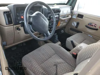 2000 Jeep Wrangler Sport with VIN 1J4FA49S1YP748529, listed as a Copart auction lot 77041924 with 154,949 mi miles and Salvage Title. Bid and sale history available at carsss.com. Image 8.