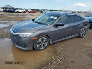 2018 Honda Civic EX-T with VIN JHMFC1F35JX018879, listed as a Copart auction lot 58633655 with 129,906 mi miles and Salvage title. Bid and sale history available at DreamBid. Image 1.