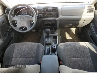 2000 Isuzu Rodeo S z VIN 4S2CK58W2Y4317915, wystawiony jako Copart lot #81780094 z przebiegiem 158 217 mil mil oraz Szkoda całkowita • Salvage title. Historia ofert i sprzedaży dostępna na DreamBid. Obrazek 8.