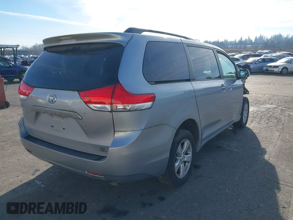 2014 Toyota Sienna LE with VIN 5TDJK3DC4ES088768, listed as a IAAI auction lot 41473251 with 100,512 mi miles and . Bid and sale history available at DreamBid. Image 4.