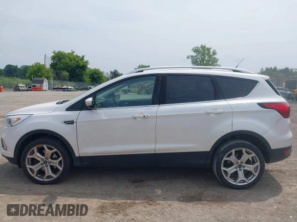 2019 Ford Escape Titanium with VIN 1FMCU9J90KUA86338, listed as a IAAI auction lot 42690159 with 115,891 mi miles and . Bid and sale history available at DreamBid. Image 15.