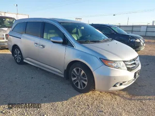 2014 Honda Odyssey Touring with VIN 5FNRL5H97EB094353, listed as a IAAI auction lot 41701712 with 141,228 mi miles and . Bid and sale history available at carsss.com. Image 1.