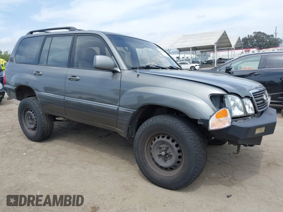 2001 Lexus LX 470 z VIN JTJHT00WX13509489, wystawiony jako IAAI lot #42227083 z przebiegiem 360 283 mil mil oraz . Historia ofert i sprzedaży dostępna na DreamBid. Obrazek 1.