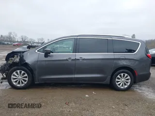 2021 Chrysler Pacifica Touring L with VIN 2C4RC1BG7MR584956, listed as a IAAI auction lot 42016887 with 51,415 mi miles and . Bid and sale history available at DreamBid. Image 15.