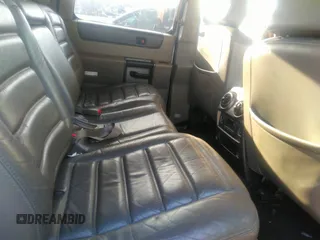 2003 Hummer H2 with VIN 5GRGN23U33H110037, listed as a IAAI auction lot 41339142 with 166,795 mi miles. Bid and sale history available at carsss.com. Image 8.