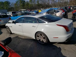 2017 Jaguar XJ with VIN SAJWJ2GD4H8W12163, listed as a Copart auction lot 86993064 with 63,697 mi miles and Salvage Title. Bid and sale history available at carsss.com. Image 2.