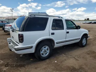 1999 Chevrolet Blazer Trailblazer z VIN 1GNDT13W0X2169505, wystawiony jako Copart lot #54000505 z przebiegiem 181 903 mil mil oraz Szkoda całkowita • Salvage title. Historia ofert i sprzedaży dostępna na DreamBid. Obrazek 3.
