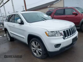 2013 Jeep Grand Cherokee Laredo with VIN 1C4RJFAG6DC557163, listed as a IAAI auction lot 42019052 with 125,058 mi miles. Bid and sale history available at carsss.com. Image 1.