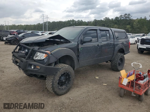 2012 Nissan Frontier Pro-4X with VIN 1N6AD0EVXCC415470, listed as a Copart auction lot 50650915 with 157,160 mi miles and Salvage title. Bid and sale history available at DreamBid. Image 1.