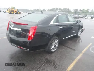 2013 Cadillac XTS Premium z VIN 2G61S5S39D9112491, wystawiony jako IAAI lot #42216373 z przebiegiem 145 338 mil mil oraz . Historia ofert i sprzedaży dostępna na DreamBid. Obrazek 4.
