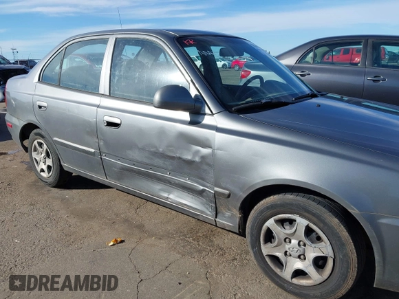 2004 Hyundai Accent GL with VIN KMHCG45C04U531177, listed as a IAAI auction lot 41526033 with 126,102 mi miles. Bid and sale history available at carsss.com. Image 6.