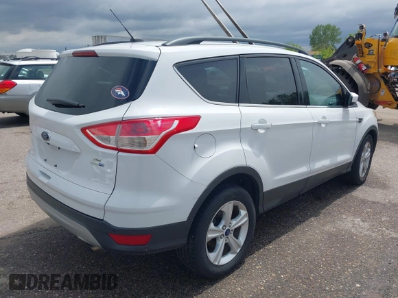 2014 Ford Escape SE with VIN 1FMCU9GX6EUD51032, listed as a IAAI auction lot 42206659 with 131,438 mi miles and . Bid and sale history available at DreamBid. Image 4.