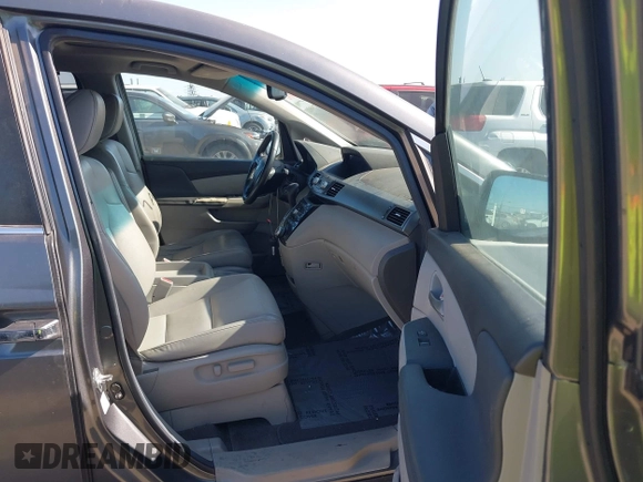 2012 Honda Odyssey EX-L with VIN 5FNRL5H6XCB061026, listed as a IAAI auction lot 42574612 with 144,480 mi miles and . Bid and sale history available at DreamBid. Image 5.