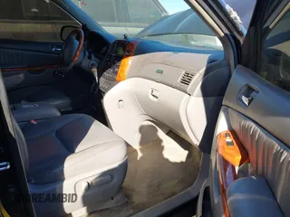 2009 Toyota Sienna XLE with VIN 5TDZK22C69S273555, listed as a IAAI auction lot 41276221 with 129,160 mi miles and . Bid and sale history available at DreamBid. Image 5.