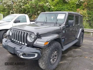 2021 Jeep Wrangler Unlimited Sahara with VIN 1C4JJXP60MW704738, listed as a IAAI auction lot 42042079 with 63,765 mi miles and . Bid and sale history available at DreamBid. Image 17.