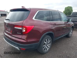 2021 Honda Pilot EX-L with VIN 5FNYF6H53MB094015, listed as a IAAI auction lot 42545722 with 66,065 mi miles and . Bid and sale history available at DreamBid. Image 4.