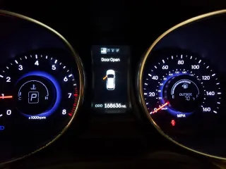 2013 Hyundai Santa Fe Sport z VIN 5XYZUDLA5DG076949, wystawiony jako Copart lot #55758515 z przebiegiem 168 636 mil mil oraz Szkoda całkowita • Salvage title. Historia ofert i sprzedaży dostępna na DreamBid. Obrazek 9.
