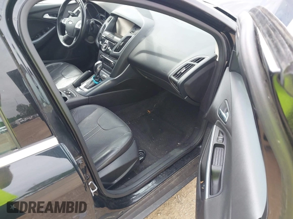 2014 Ford Focus Titanium with VIN 1FADP3N25EL194433, listed as a IAAI auction lot 42512912 with 105,355 mi miles and . Bid and sale history available at DreamBid. Image 5.