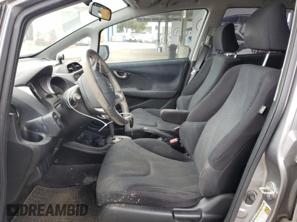 2009 Honda Fit Sport z VIN JHMGE884X9C002533, wystawiony jako Copart lot #62222155 z przebiegiem 133 148 mil mil oraz Czysty tytuł • Clean title. Historia ofert i sprzedaży dostępna na DreamBid. Obrazek 7.