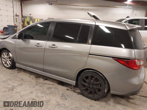 2012 Mazda 5 Touring z VIN JM1CW2CL1C0107706, wystawiony jako IAAI lot #41551479 z przebiegiem 123 418 mil mil oraz . Historia ofert i sprzedaży dostępna na DreamBid. Obrazek 3.