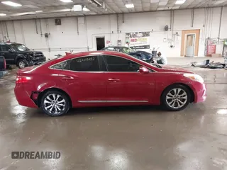 2012 Hyundai Azera z VIN KMHFG4JG7CA183643, wystawiony jako IAAI lot #42503232 z przebiegiem 180 485 mil mil oraz . Historia ofert i sprzedaży dostępna na DreamBid. Obrazek 13.