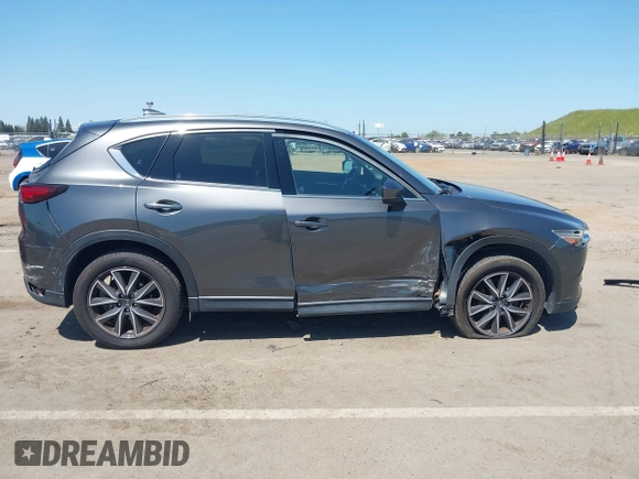 2017 Mazda CX-5 Grand Touring with VIN JM3KFADL6H0217850, listed as a IAAI auction lot 42033404 with 74,198 mi miles and . Bid and sale history available at carsss.com. Image 14.