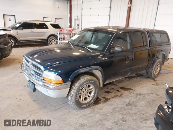 2003 Dodge Dakota SLT with VIN 1D7HL48N63S177233, listed as a IAAI auction lot 42167711 with 163,511 mi miles and . Bid and sale history available at carsss.com. Image 2.