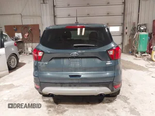 2019 Ford Escape SE z VIN 1FMCU9GDXKUA54699, wystawiony jako IAAI lot #41667188 z przebiegiem 127 376 mil mil oraz . Historia ofert i sprzedaży dostępna na DreamBid. Obrazek 16.