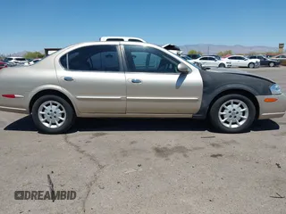 2000 Nissan Maxima GXE z VIN JN1CA31D0YT739248, wystawiony jako IAAI lot #42089086 z przebiegiem 140 979 mil mil oraz . Historia ofert i sprzedaży dostępna na DreamBid. Obrazek 13.
