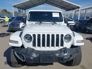 2021 Jeep Wrangler Unlimited Sahara z VIN 1C4JJXP6XMW765398, wystawiony jako IAAI lot #41592185 z przebiegiem 26 834 mil mil oraz . Historia ofert i sprzedaży dostępna na DreamBid. Obrazek 12.