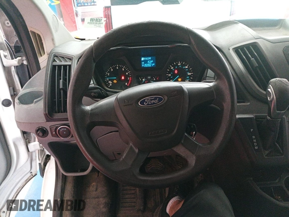 2015 Ford Transit Cargo with VIN 1FTNE1YM4FKA87516, listed as a IAAI auction lot 42901216 with 269,921 mi miles and . Bid and sale history available at DreamBid. Image 32.