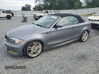 2012 BMW 1 Series 135i with VIN WBAUN7C59CVM26082, listed as a Copart auction lot 74711754 with 77,152 mi miles and Salvage title. Bid and sale history available at DreamBid. Image 1.