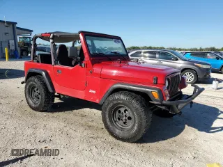 1999 Jeep Wrangler SE with VIN 1J4FY29P8XP483909, listed as a Copart auction lot 48679555 with 168,708 mi miles and Salvage title. Bid and sale history available at DreamBid. Image 4.