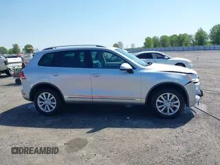 2014 Volkswagen Touareg Sport with VIN WVGEF9BP6ED007436, listed as a IAAI auction lot 41953307 with 114,925 mi miles and . Bid and sale history available at DreamBid. Image 13.