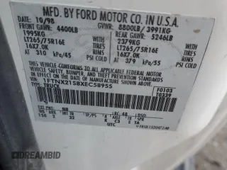 1999 Ford F-250 XL with VIN 1FTNX21S8XEC58955, listed as a Copart auction lot 84917334 with 272,953 mi miles and Salvage title. Bid and sale history available at DreamBid. Image 12.