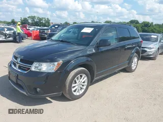 2013 Dodge Journey SXT with VIN 3C4PDDBG1DT615217, listed as a IAAI auction lot 42728052 with 234,347 mi miles and . Bid and sale history available at DreamBid. Image 2.