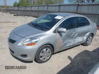 2009 Toyota Yaris with VIN JTDBT903X91301963, listed as a IAAI auction lot 42102283 with 143,966 mi miles. Bid and sale history available at carsss.com. Image 2.