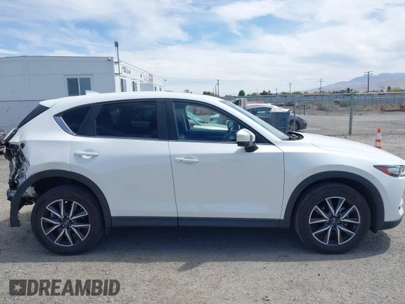 2018 Mazda CX-5 Touring with VIN JM3KFACM3J0381122, listed as a IAAI auction lot 42023838 with 76,121 mi miles. Bid and sale history available at carsss.com. Image 13.